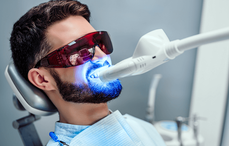 A man receiving a light treatment