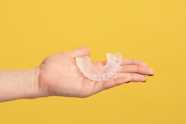 A mouthguard in an open palm