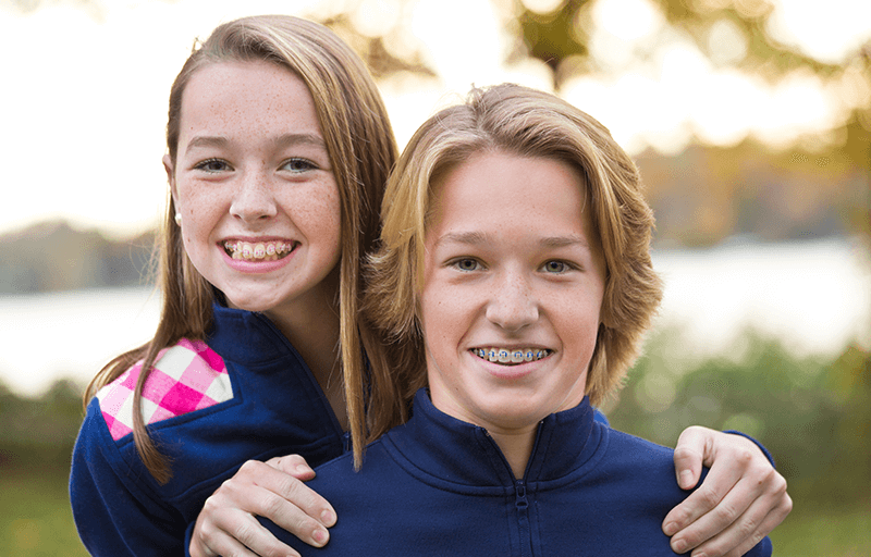 A brother and sister with braces