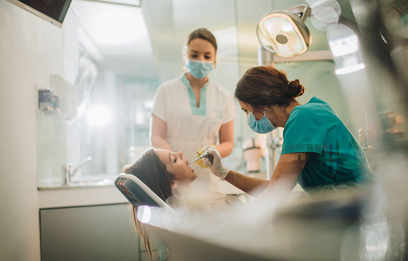 Dentist working on patient