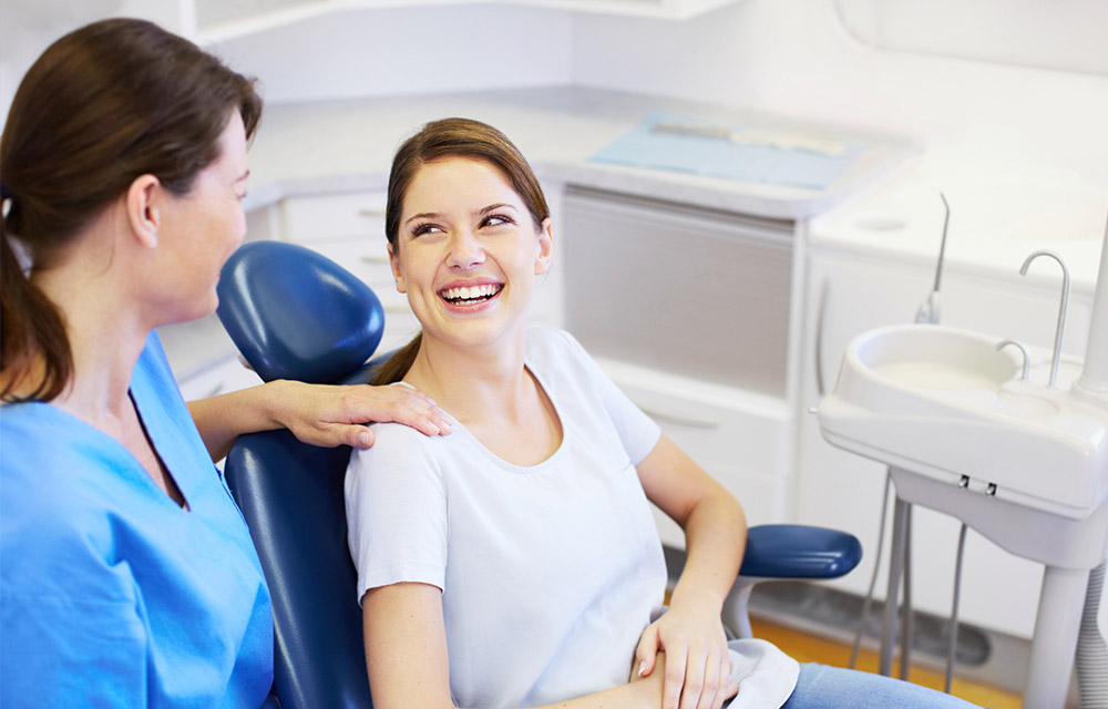 Woman smiling in Dentist Chair
