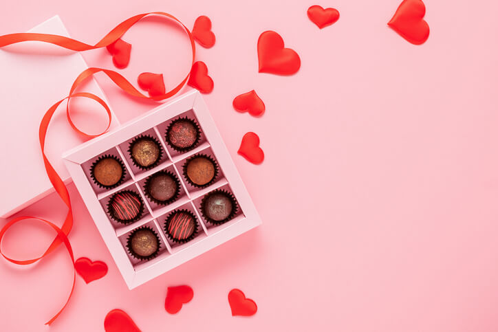 box of chocolates and pink hearts