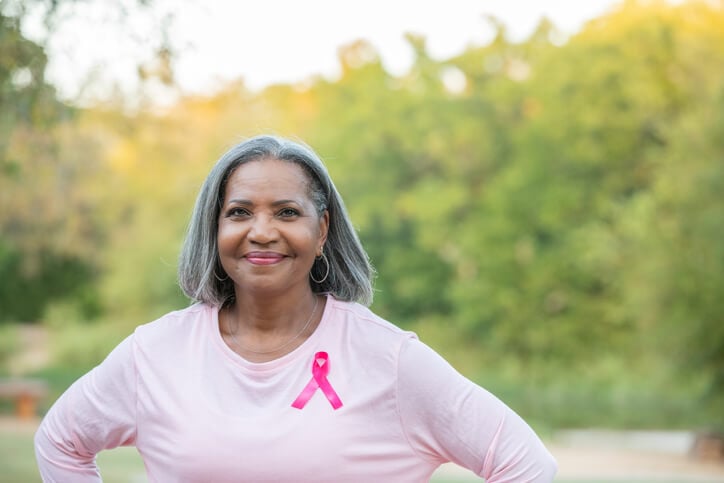 Woman wearing a pink ribbon