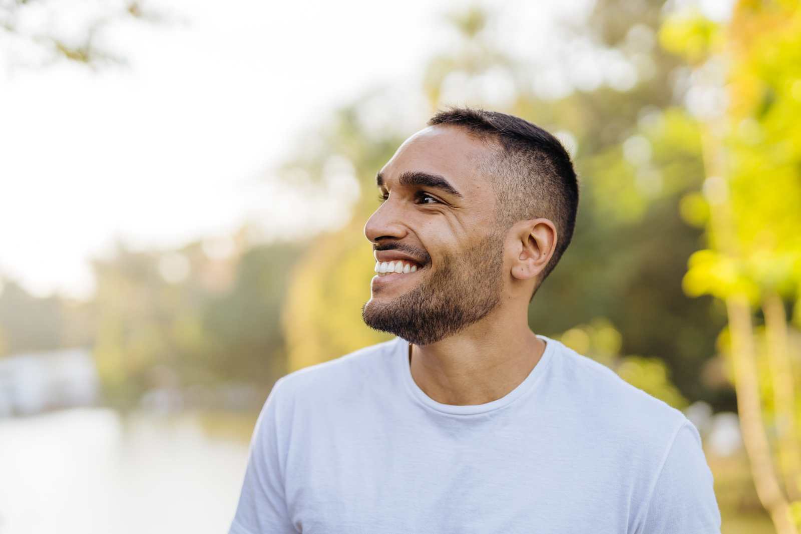 Young smiling athlete in public park