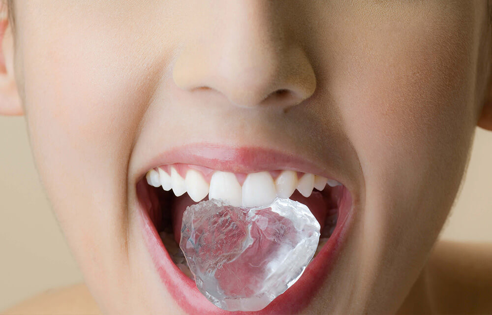 A mouth with an ice-cube