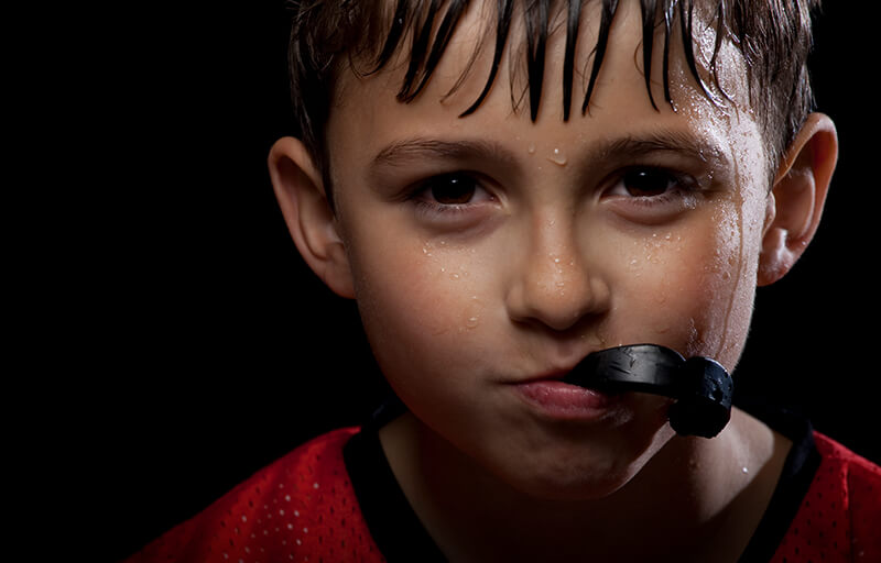 A kid with a mouthguard