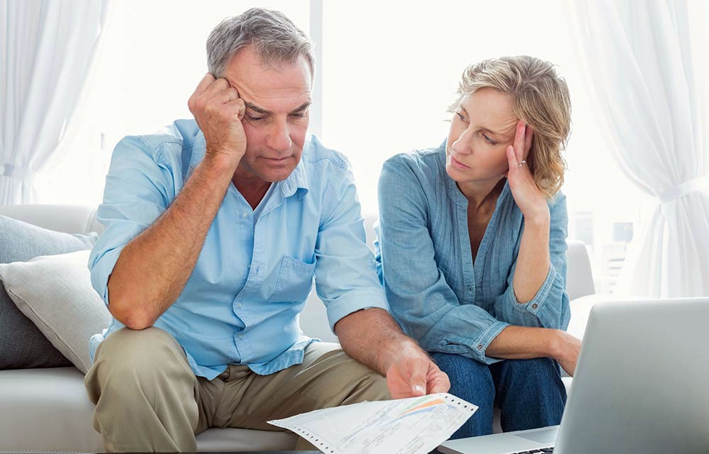photo of older couple stressed out about bills