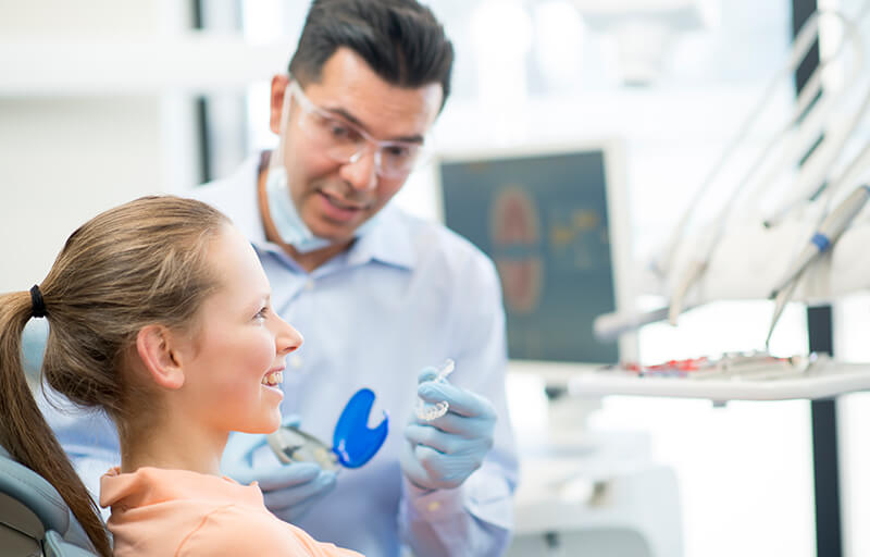 Orthodontist treating a patient