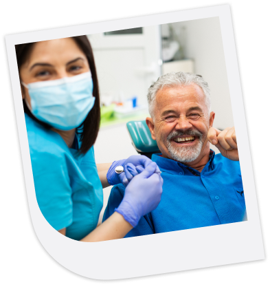 a dentist with their senior patient smiling
