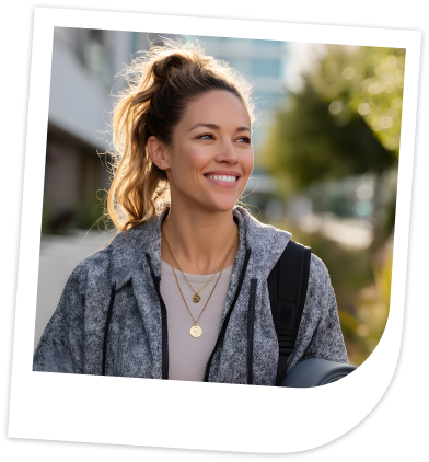 Happy woman with yoga mat
