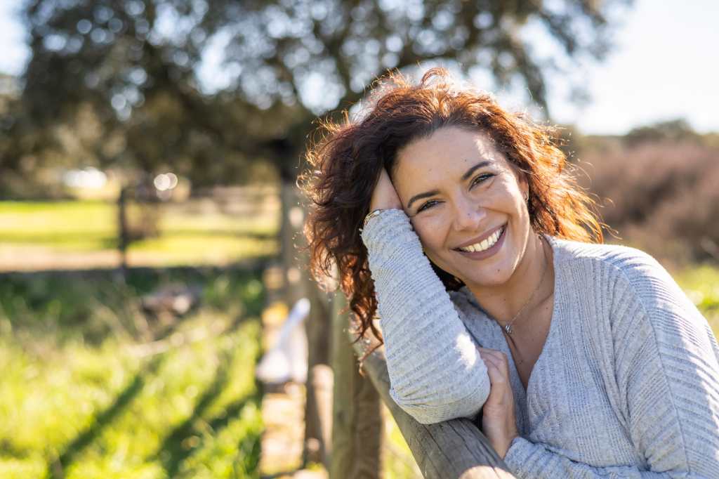 Woman smiling in a field