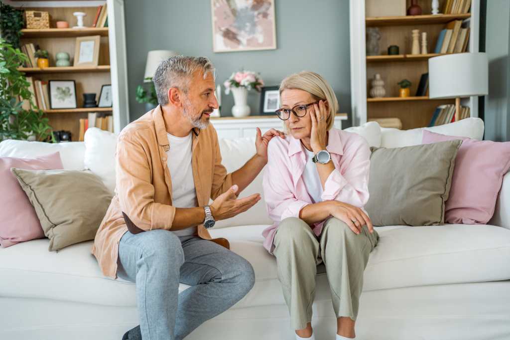 Mature husband expressing empathy and compassion to his upset wife